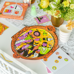Monster Mash frame serving platter with a window-cling crayon set, ghost decor, and florals.