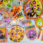 Monster Mash spread with framed-monster plates, crayon favors, notepads, and a ghost-frame napkin.