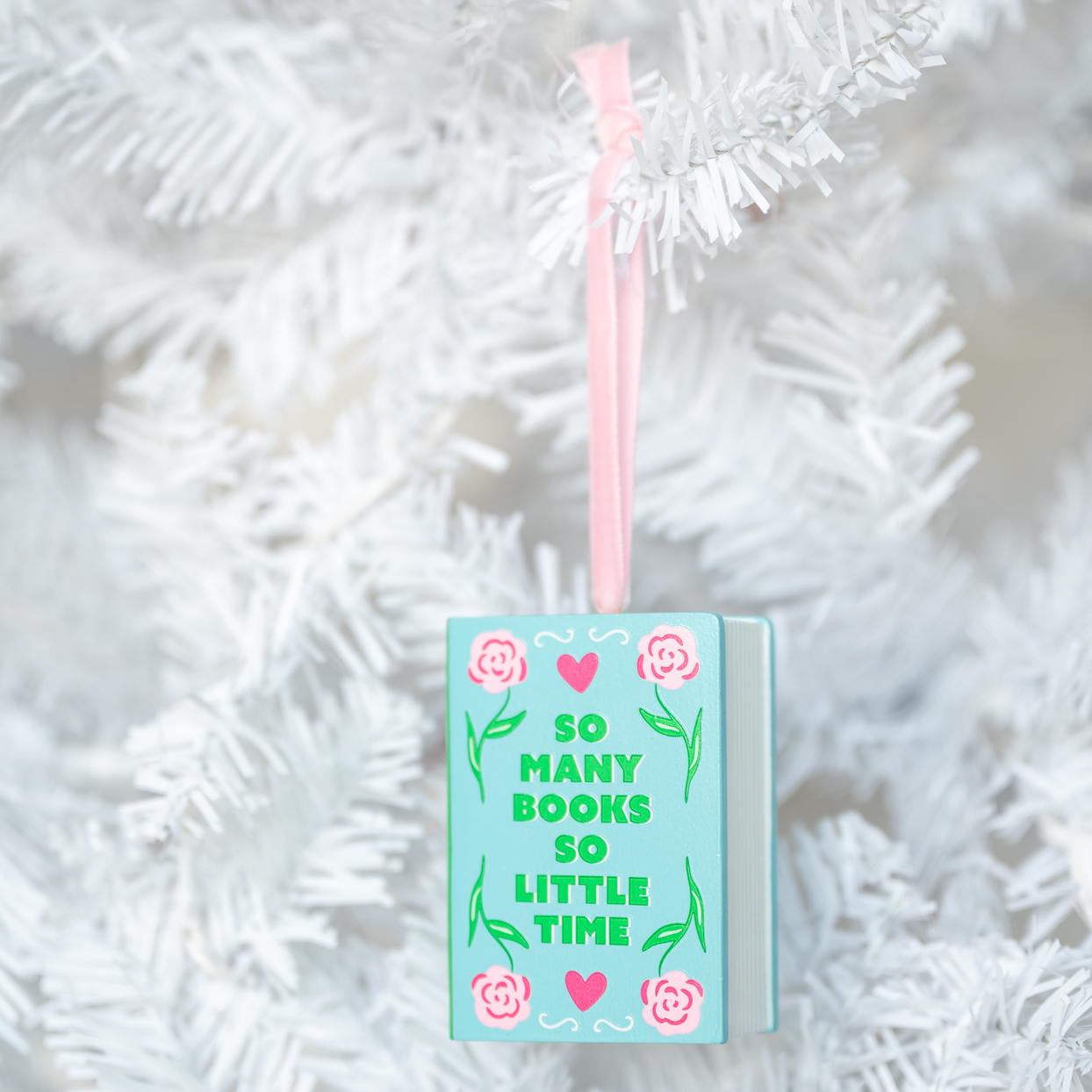 So Many Books, So Little Time Christmas Ornament, styled on a tree.