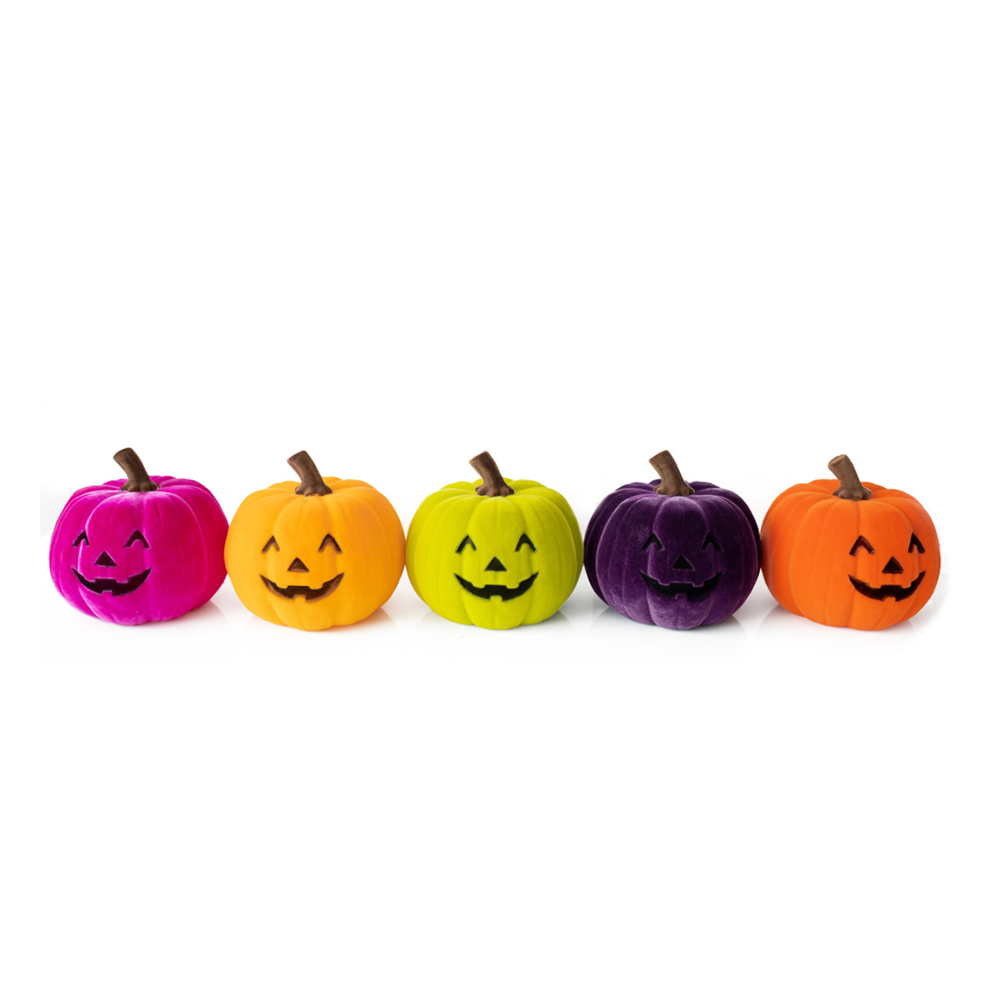 Flocked jack-o'-lantern pumpkins in an assortment of colors, grouped together.